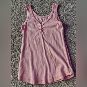 Really nice tank top. A little longer and loose depending. Never worn.